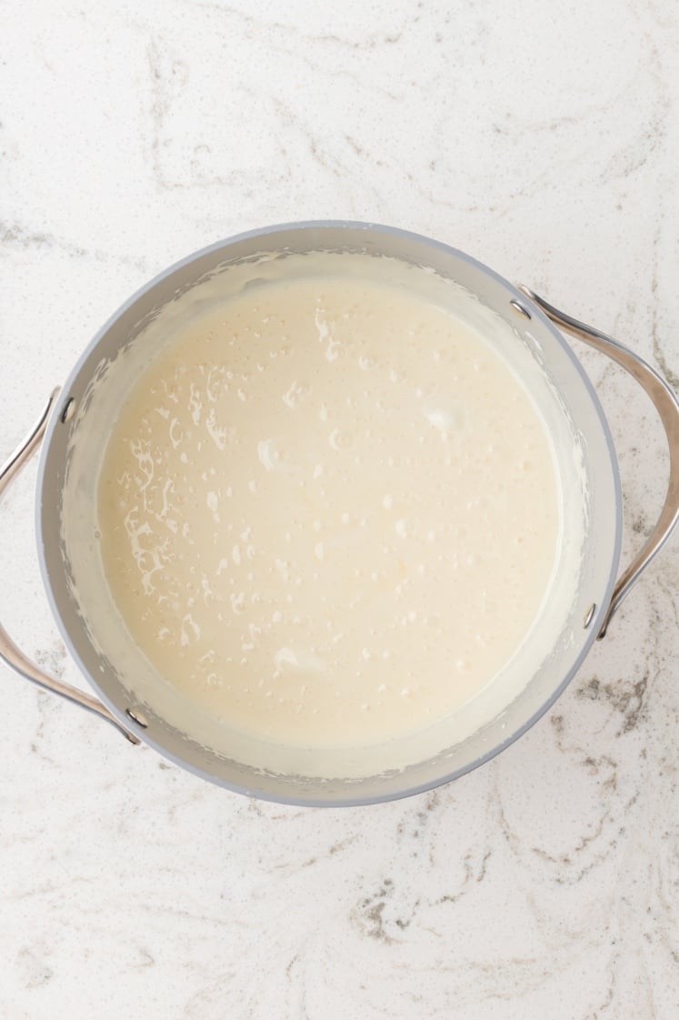 Melted marshmallow mixture in a saucepan.