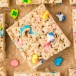 Close-up of Lucky Charms rice krispies treat squares with marshmallow pieces.