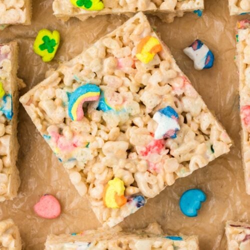 Close-up of Lucky Charms rice krispies treat squares with marshmallow pieces.