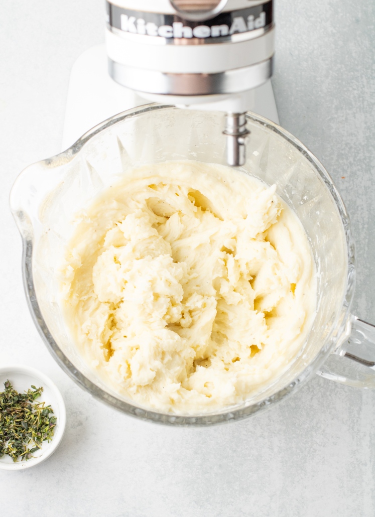 The potatoes are whipped until smooth and fluffy, with the butter fully mixed in. This creates a creamy, spreadable mash that’s easy to layer over the filling and bakes up with a lightly golden top.