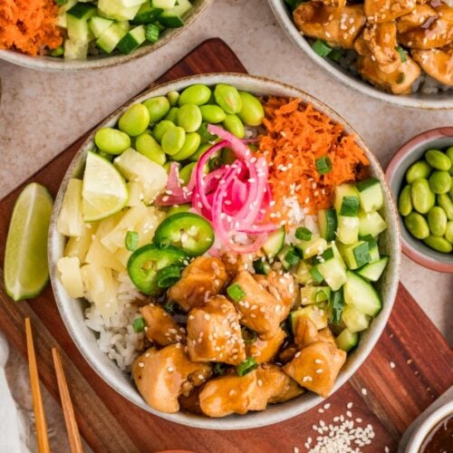 This is the kind of bowl that feels balanced without trying too hard. Warm rice, saucy chicken, and a mix of cool, crisp toppings give you something different in every bite.